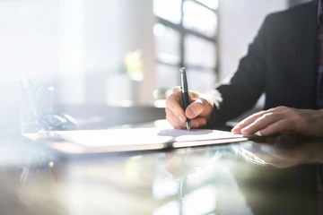 What Is a Fixed-Term Contract? Meaning + Pros & Cons